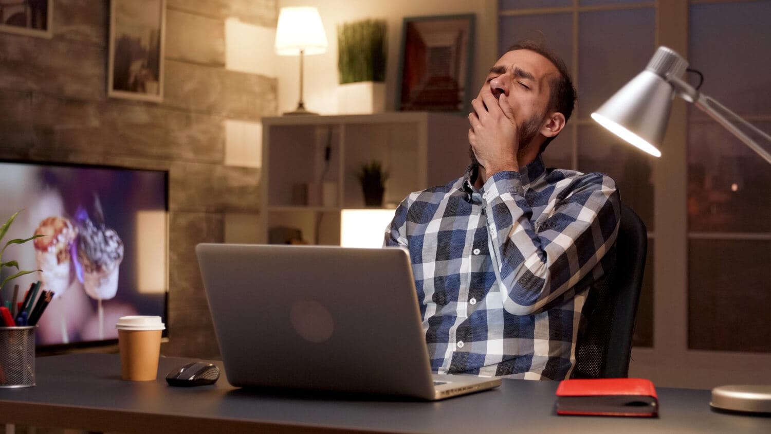tiredness of a man on desk might hint a chronic stress 